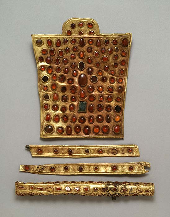 ‘This fine and rare set of horse trappings is decorated with stones in beaded settings- a style Hunnish metalworkers favored. Fourth century. The large piece is a chamfron, which was worn on the horse's head above the eyes. This one is ornamental rather than defensive and indicated the wealth and power of the horse's owner.’ 