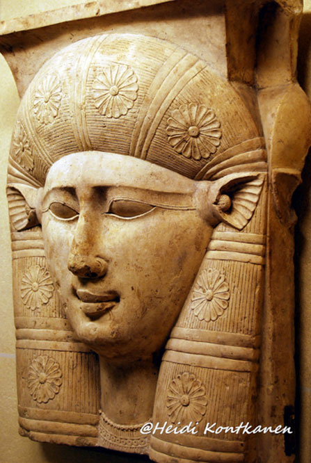 A fragment of a capital from a column depicts the face of the goddess Hathor, with cow ears. 3rd century BC, Ptolemaic. Louvre Museum, Paris.