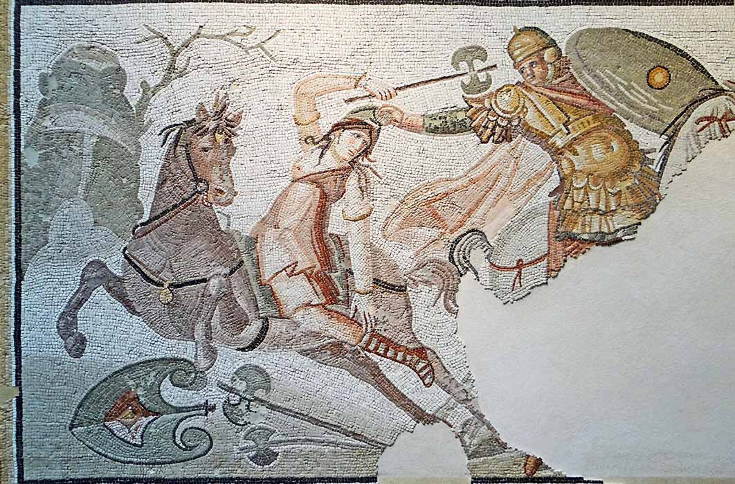 A hippeis rider seizes a mounted Amazonian warrior armed with a labrys by her Phrygian cap. Roman mosaic Daphne, Antioch-on-the-Orontes (now Antakya in Turkey), (fourth century AD)/ Louvre, Paris. (Jacques MOSSOT/ CC BY-SA 4.0)