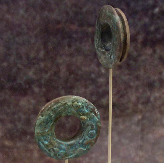 Copper ear spools from Spiro Mounds, Oklahoma - Northern Caddoan Mississippian archaeological site located in Eastern Oklahoma. Representational image.