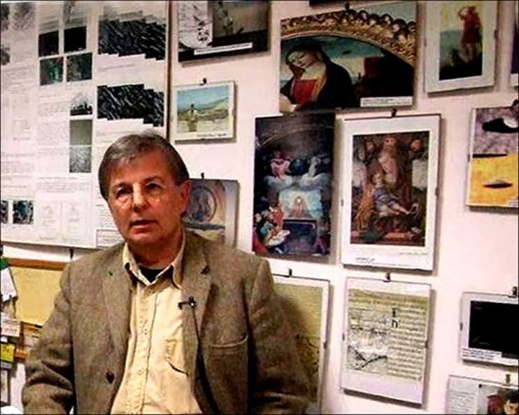 Dr Roberto Volterri in his study at the university, with behind him a good number of images about strange objects that in the distant past evolved in our skies and that were immortalized by some famous painters (Image: Courtesy Roberto Volterri)
