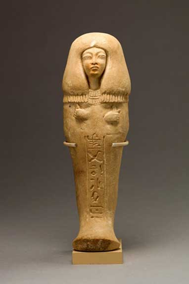 Funerary figurine of Isis, ‘Singer of the Aten’. During Akhenaten’s reign, the traditional gods were forsaken, and so, this shabti is not inscribed with Spell Six from the Book of the Dead and makes no mention of the funerary god Osiris, as was the norm. Instead, prayers to the king and the Aten were used. 