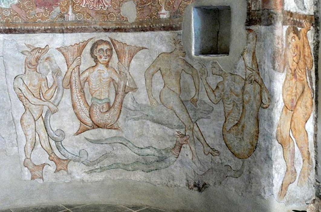 Tramin (South Tyrol. )Saint James church in Kastelaz: Romanesque frescos (1210s ) showing fantastic creatures. (Public Domain)
