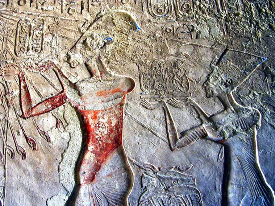 Painted wall relief shows Akhenaten and Neferiti worshipping the Aten. Tomb of Meryre II, Tell el-Amarna.