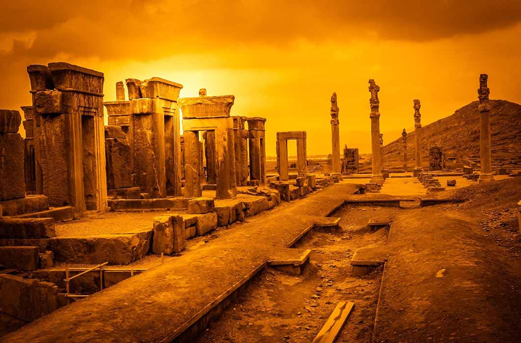 The sun sets on the ruins of Persepolis burnt by Alexander the Great in 330 BC (Pav-Pro Photography / Adobe Stock)