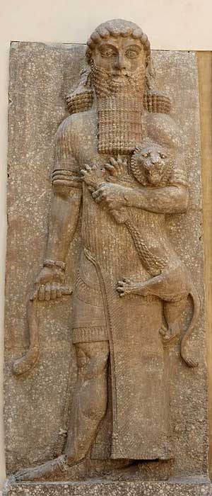 Possible representation of Enkidu as Master of Animals grasping a lion and snake, in an Assyrian palace relief, from Dur-Sharrukin, now Louvre (Public Domain)