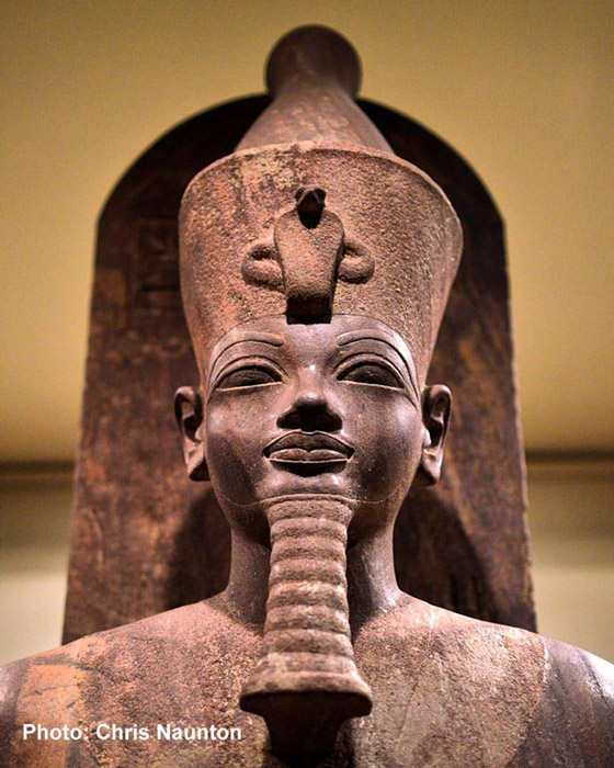 Probably a cult statue, this detail of a vibrant quartzite sculpture depicts an able-bodied, sled-borne image of a striding Amenhotep III wearing the Double Crown. It was found in the famed Luxor Cachette in 1989 on the western side of the king’s colonnaded solar court. Luxor Museum.