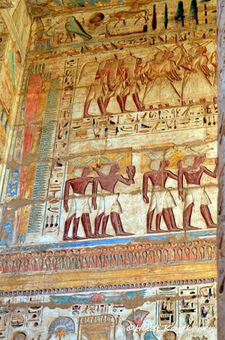Ramesses III introduced the system of deeply carved inscriptions, probably in an effort to discourage successors from usurping his monuments. If so, the ploy worked very well. In this colorful scene, subjects from different lands await their turn to pay homage to the Pharaoh during the Festival of Min.