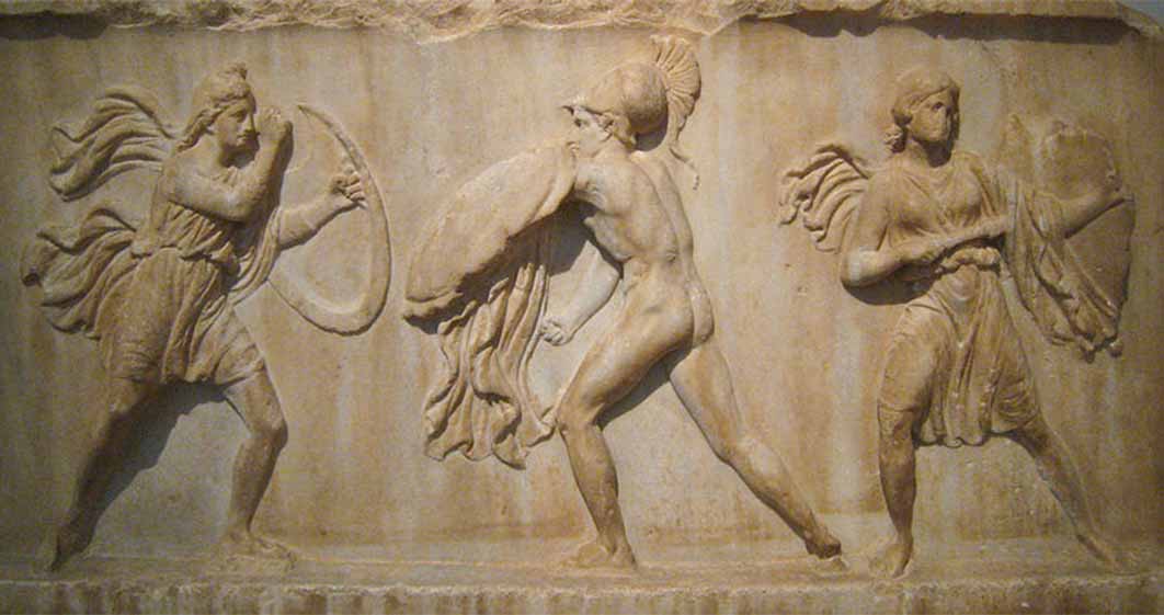 Relief slab from a frieze depicting an Amazonomachy (two Amazons fighting a Greek warrior. (Mid-fourth century BC) National Archaeological Museum in Athens (CC BY-SA 2.0)