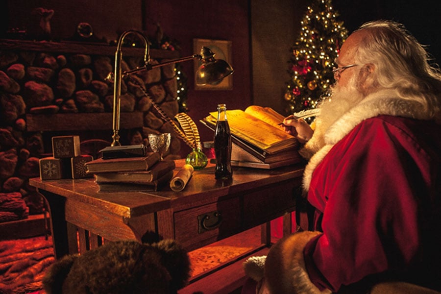 Santa Claus at Desk with Cola Bottle (Cinestock / Adobe Stock)