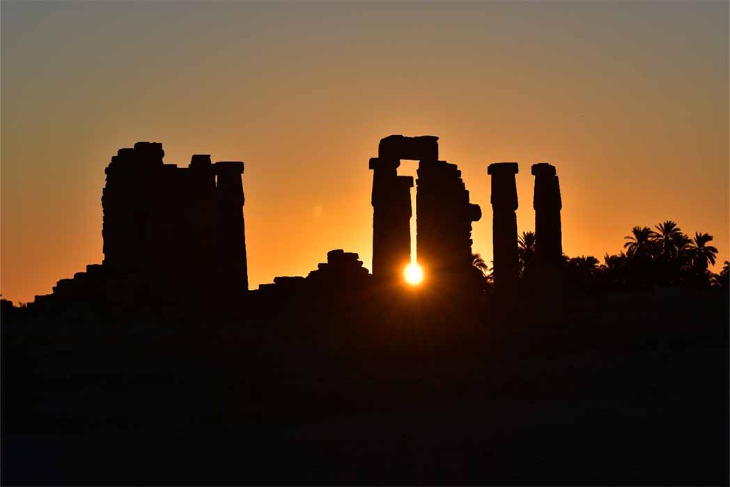 Sunset at temple ruins of Soleb, Sudan (Thomas / Adobe Stock)