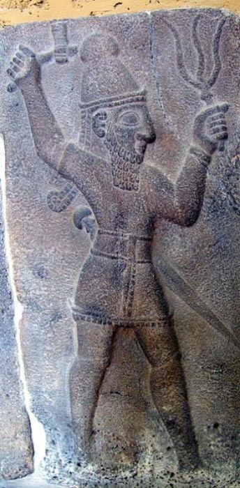 Teshub the Hittite weather-god wielding a thunderbolt and an axe. Bas-relief at Ivriz (Public Domain)