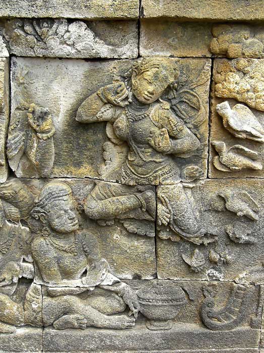 The Apsara of Borobudur, the flying celestial maiden depicted in a bas-relief of the 9th-century Borobudur temple, Java, Indonesia. 