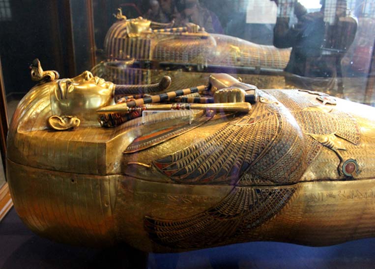 (Foreground) The dazzling, solid gold innermost coffin of King Tutankhamun and (Background) the middle coffin; from a nest of three. As Treasurer, Maya was in charge of assembling funerary goods destined for KV62. Egyptian Museum, Cairo. (CC BY-SA 4.0)