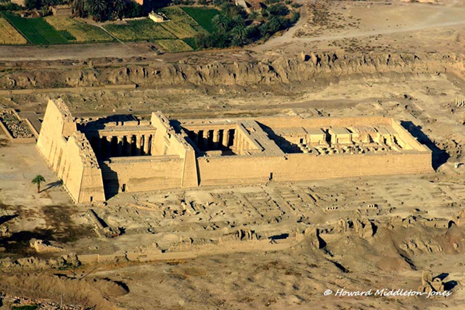 The imposing Mortuary Temple of Ramesses III at Medinet Habu. The pharaoh used this structure as his royal palace and later converted it into a war memorial in order to commemorate his victory over the Sea Peoples and the Libyans. This image was shot during an aerial survey of the West Bank in 2010.
