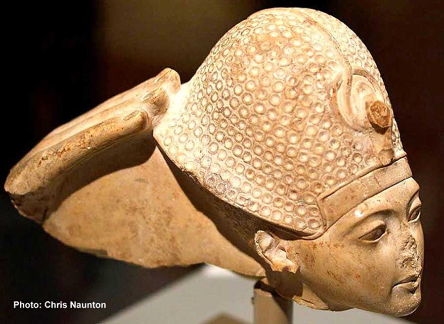 This head of indurated limestone is a fragment from a statue group that represented the god Amun seated on a throne and Tutankhamun standing or kneeling in front of him. All that remains of Amun is his right hand, which touches the back of the king’s crown in a gesture that signifies Tutankhamun’s investiture as king. Metropolitan Museum of Art, New York.