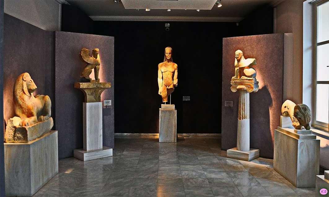Sacred Gate kouros (center) in Room 1 of the Kerameikos Archaeological Museum (