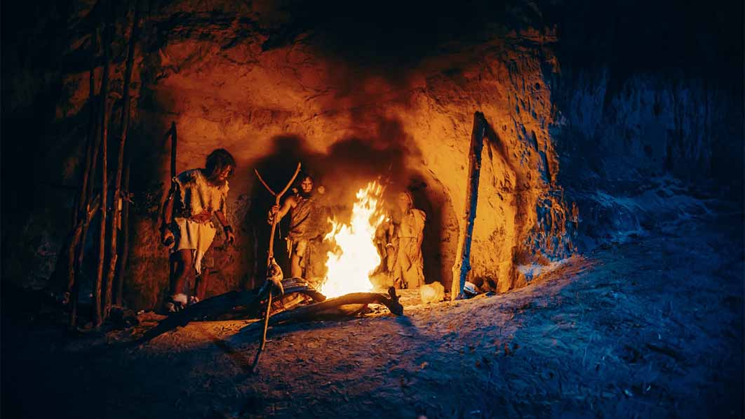 Hunter-gatherers harnessing fire (Gorodenkoff / Adobe Stock)