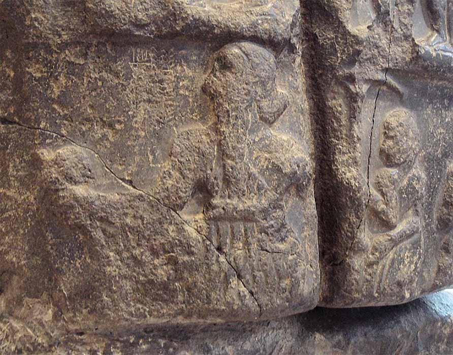 Sargon on his victory stele, followed by an attendant holding a royal umbrella. The name of Sargon in cuneiform ("King Sargon") appears faintly in front of his face. Louvre Museum (CC BY-SA 2.0)