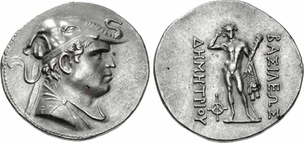 Demetrios I Aniketos (circa 200 - 185 BC) Tetradrachma. Diademed and draped bust right, wearing elephant-skin headdress (evoking Alexander the Great), symbol of his conquests in India, which greatly expanded the Hellenistic and Graeco-Roman realm/ Herakles standing facing, crowning himself, holding club and lion skin; monogram to inner left. (CC BY-SA 3.0)