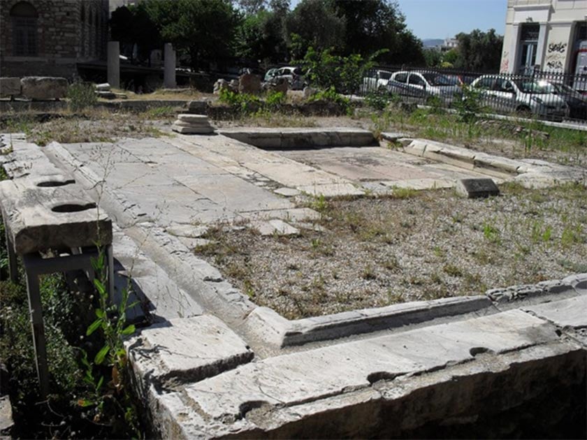 Ruins of the public toilets in the Roman Agora of Athens, showing two toilet seats and the furrow (Image: Courtesy Micki Pistorius)