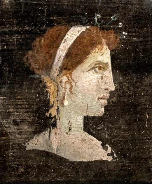 Most likely a posthumously painted portrait of Cleopatra with red hair and her distinct facial features, wearing a royal diadem and pearl-studded hairpins (First century AD) Roman Herculaneum, Italy. (Ángel M. Felicísimo/CC BY-SA 2.0)