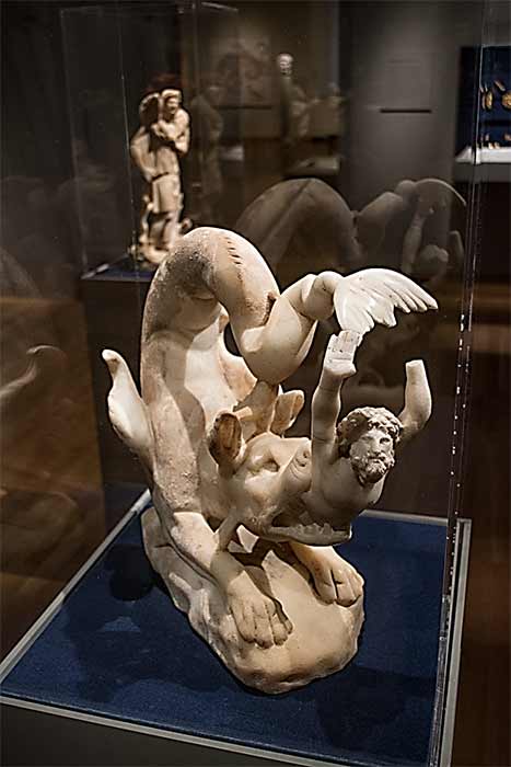 Left: Christian sculpture of Jonah being swallowed by Cetus (480 AD) (CC0). Right: then being disgorged (CC0) Cleveland Museum of Art.