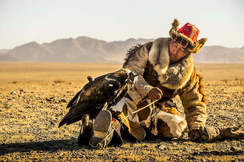 A Mongolian man and his eagle.