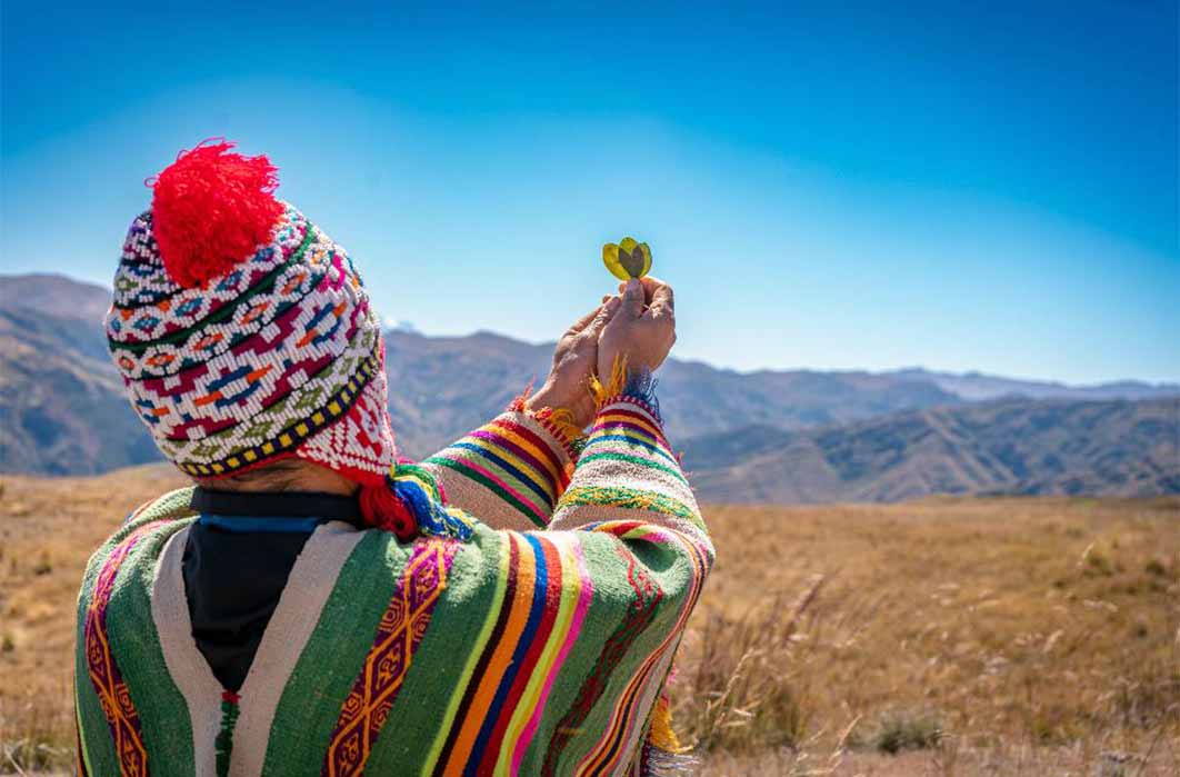Performing an offering ceremony to Pachamama in the Andes region of Peru. Source: Yuri - Supay / Adobe Stock