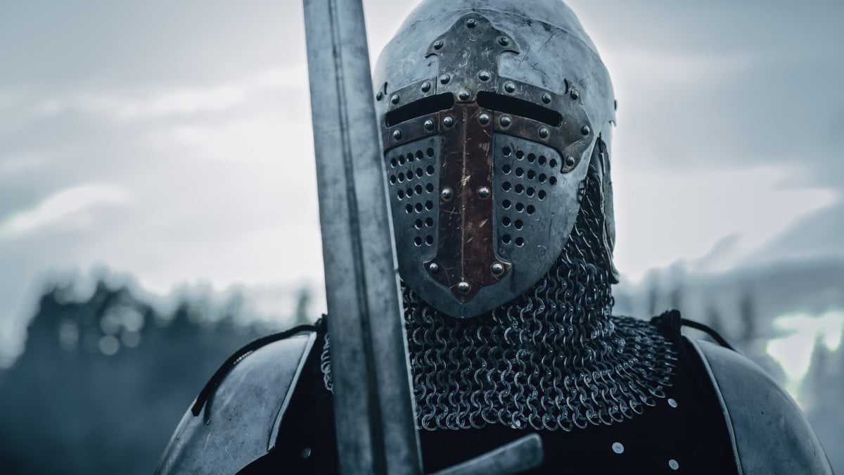 Medieval knight wearing armor, ready to fight in battle.