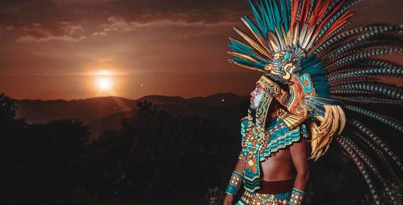 AI Generated image depicting Aztec warrior looking towards the setting sun – (  ivan / Adobe Stock)