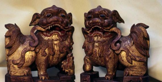 A pair of wooden shiziguo type lions decorated with gilt and polychrome.  The female has a cub, symbolizing a happy family.  Chinese, early Ching Dynasty (Image: © Walther G. von Krenner)