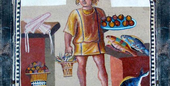 A boy holding a platter of fruits with a bucket of crabs, in a kitchen with fish and squid, on the June panel from a mosaic depicting the months (3rd century) 