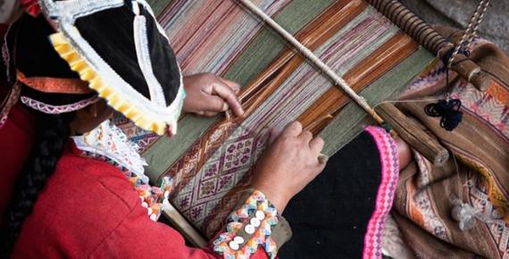 This woman is showing how local textiles are woven. Cuzco, Peru