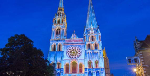 The illuminated Our Lady of Chartres cathedral, France (kovalenkovpetr / Adobe Stock)