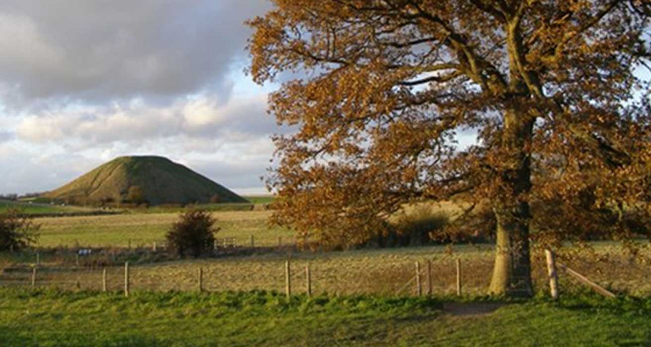 Silbury Hill on the left, is the largest prehistoric mound in Europe.