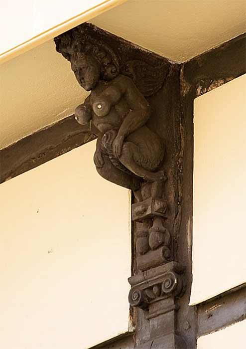 A 16th century wooden corbel supporting a jettied floor of a former coaching inn in Cambridge. The bracket is in the form of a succubus, showing that the inn was also a brothel. (Andrew Dunn/CC BY-SA 2.0)